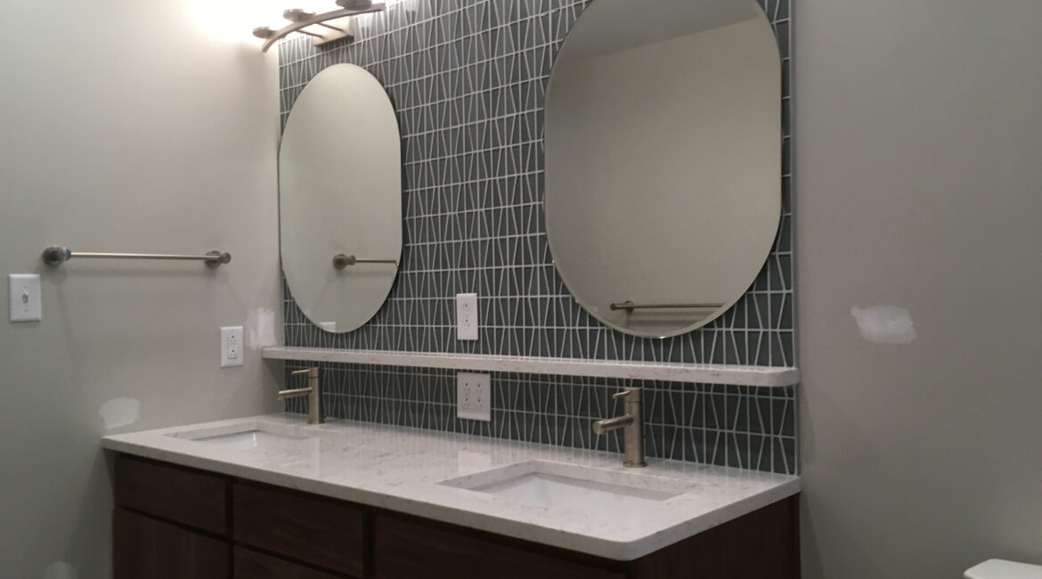 Bathroom Remodel Featuring Vanity and Backsplash